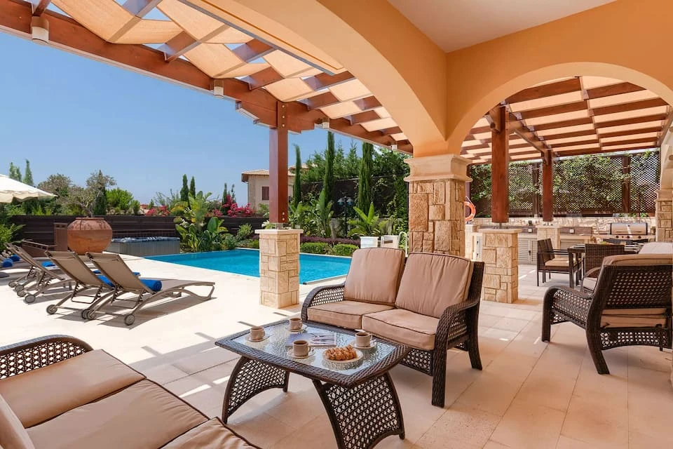 The shaded terrace and outdoor seating at Villa AJ05